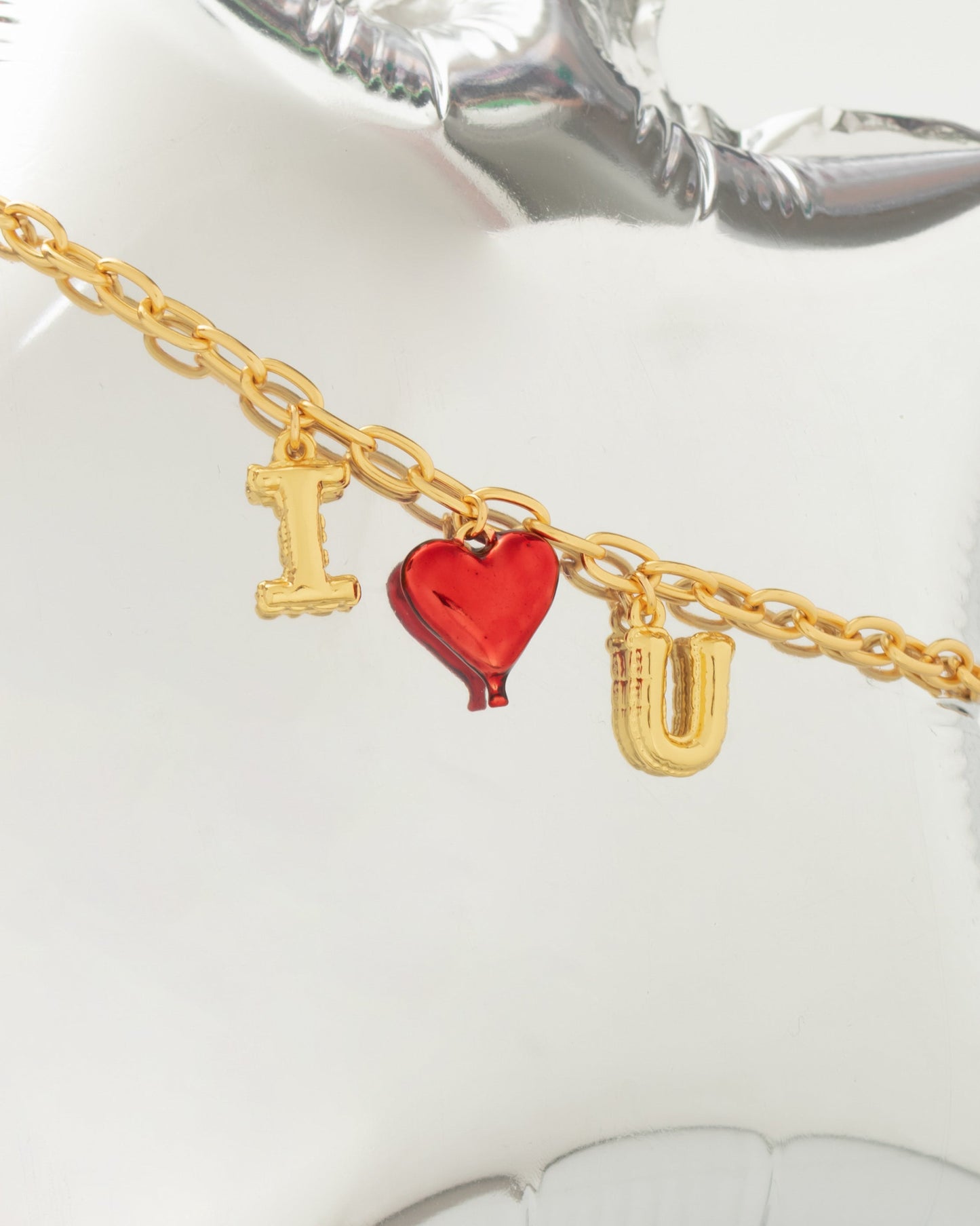 PULSERA MULTICHARMS LETRAS GLOBO*