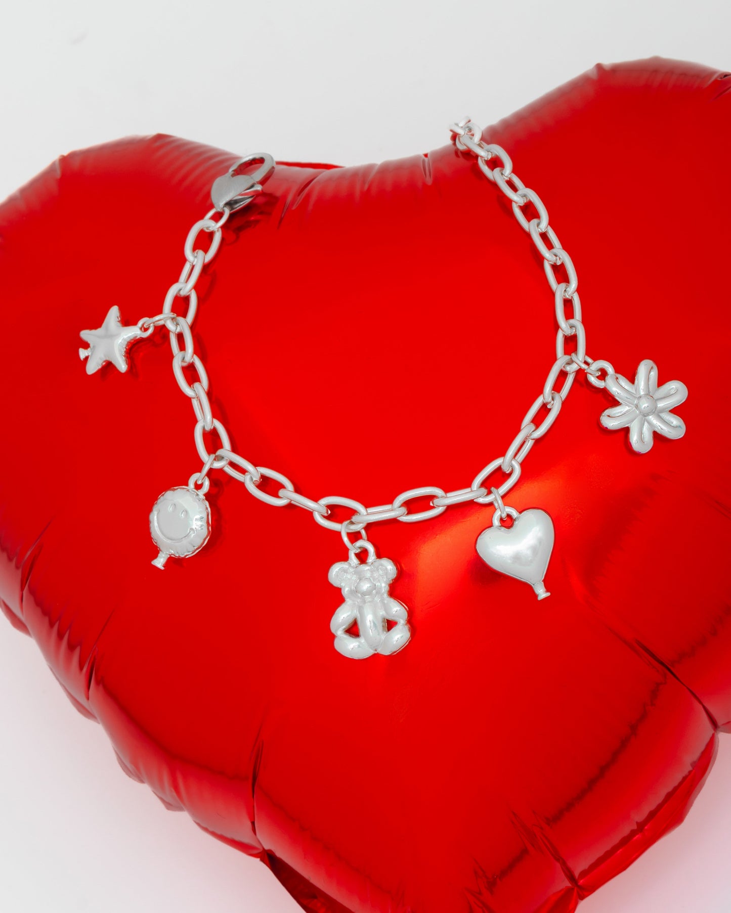 PULSERA MULTICHARMS FIGURAS GLOBO*