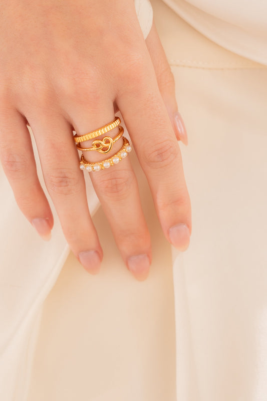 SET X3 ANILLOS PERLAS CORAZÓN LAZO